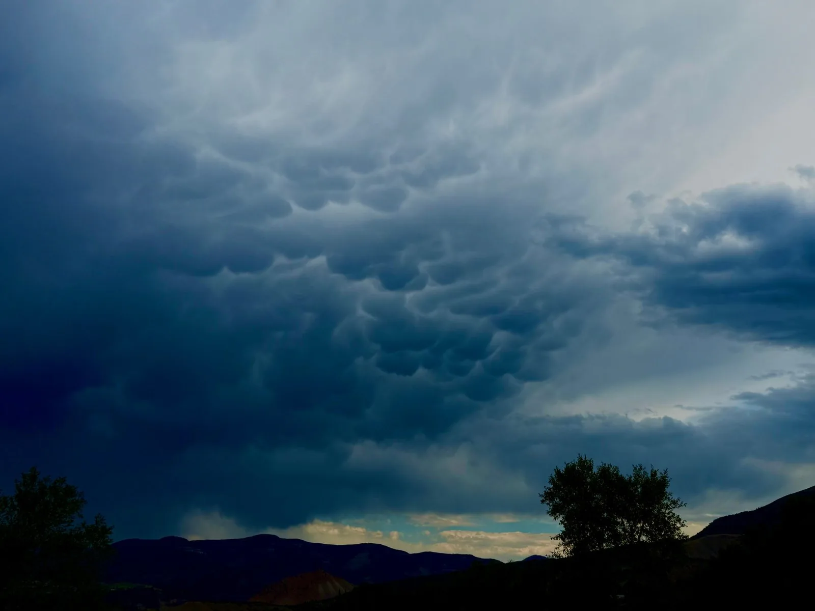 Mammatus storm building over the mountains